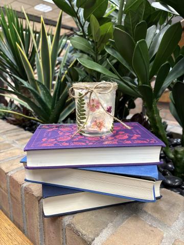 Clear votive with pressed flowers and decorative twine